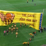 The Hawks' banner shows they aim to end the Cats' streak at 8